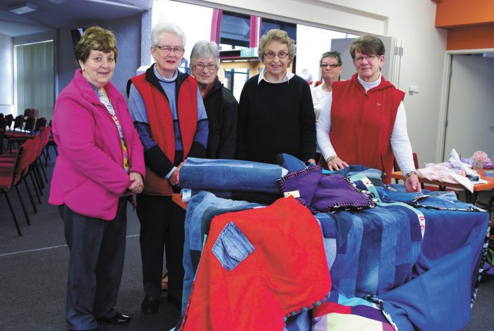 Members from left Elaine Martin, Claire Green, Margaret Ranson, Margaret Hoey, Elaine Holman, Jan McGrath with some of their blankets.