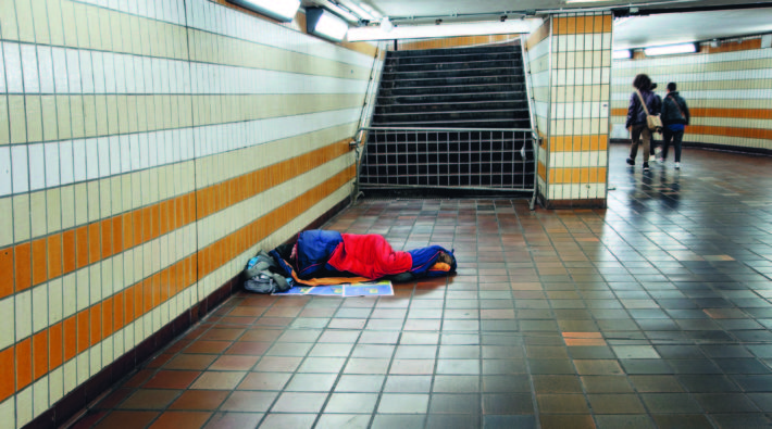 Homeless Man Sleeping in the Underground